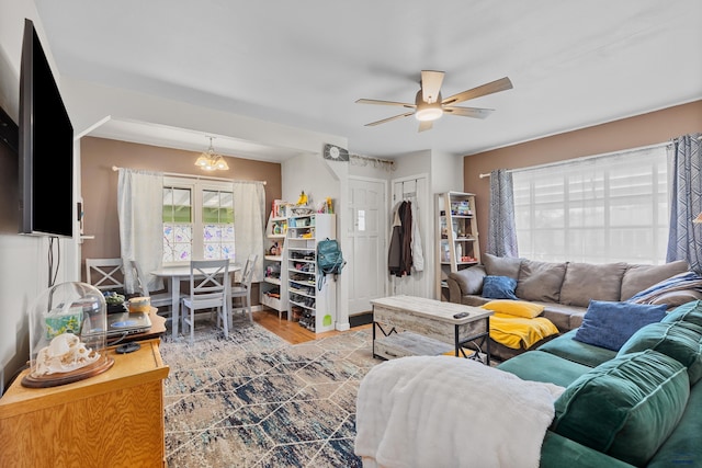 living area featuring a ceiling fan