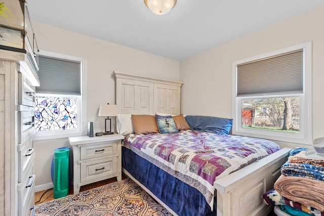 bedroom with wood finished floors