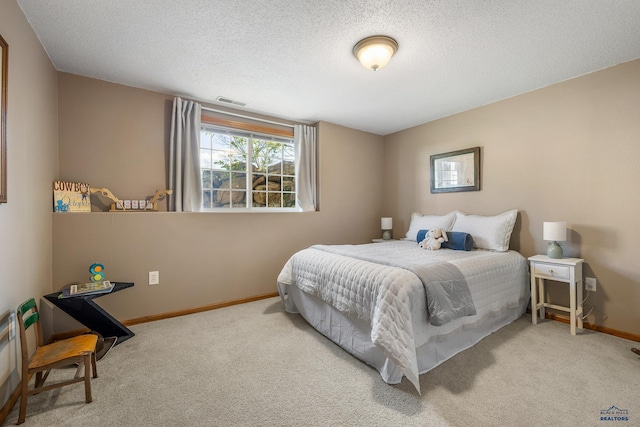 5201 Cale Ct, Rapid City, SD 57701 - carpeted bedroom with baseboards, a textured ceiling, and visible vents