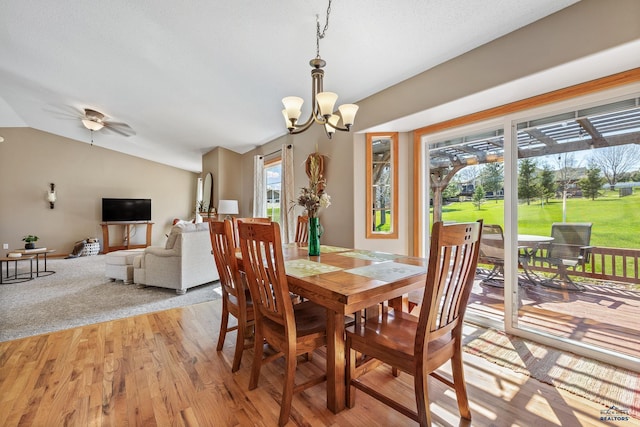 5201 Cale Ct, Rapid City, SD 57701 - dining room with light wood finished floors, ceiling fan with notable chandelier, and lofted ceiling