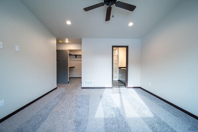 1241 Kenai Dr, Box Elder, SD 57719 - interior space with a ceiling fan, visible vents, baseboards, lofted ceiling, and light carpet