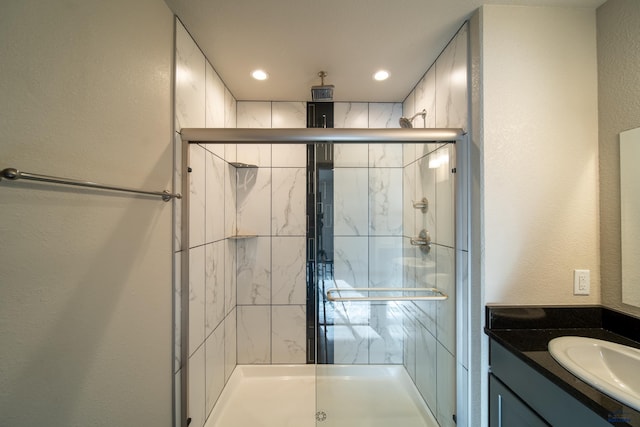 1241 Kenai Dr, Box Elder, SD 57719 - full bathroom featuring vanity, recessed lighting, a textured wall, and a stall shower