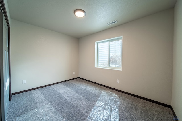 1241 Kenai Dr, Box Elder, SD 57719 - unfurnished room with carpet floors, baseboards, and visible vents