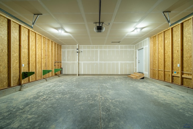 1241 Kenai Dr, Box Elder, SD 57719 - garage featuring a garage door opener