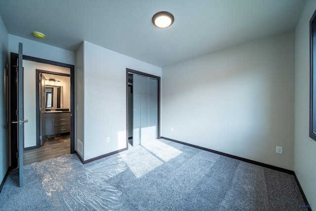1241 Kenai Dr, Box Elder, SD 57719 - unfurnished bedroom featuring baseboards, carpet, ensuite bathroom, and visible vents