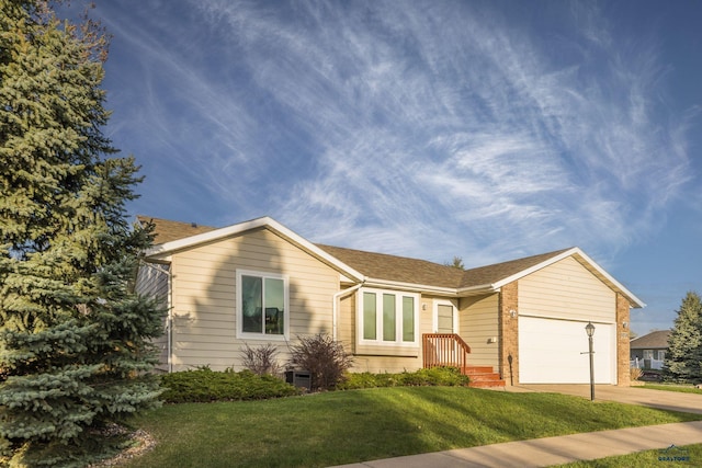 5235 Weathervane Ln, Rapid City, SD 57703 - ranch-style house featuring brick siding, a garage, a front yard, central AC unit, and concrete driveway