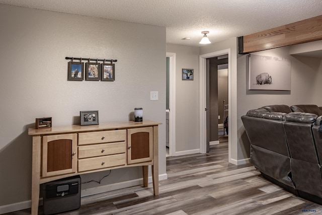 5235 Weathervane Ln, Rapid City, SD 57703 - interior space featuring baseboards, a textured ceiling, and wood finished floors