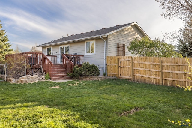 5235 Weathervane Ln, Rapid City, SD 57703 - rear view of property with a gate, a fenced backyard, a yard, and a deck
