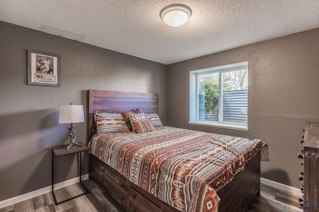 5235 Weathervane Ln, Rapid City, SD 57703 - bedroom with baseboards, a textured ceiling, and wood finished floors