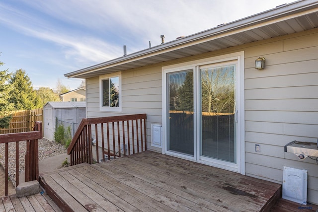 5235 Weathervane Ln, Rapid City, SD 57703 - wooden terrace featuring an outdoor structure, fence, and a shed