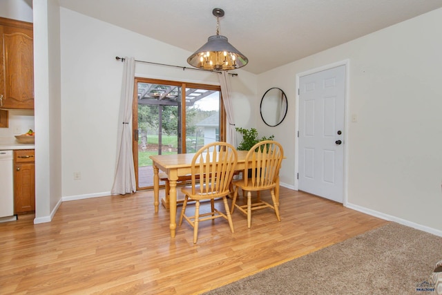 3005 Glenwood Dr, Rapid City, SD 57702 - dining space featuring an inviting chandelier, baseboards, and light wood-type flooring