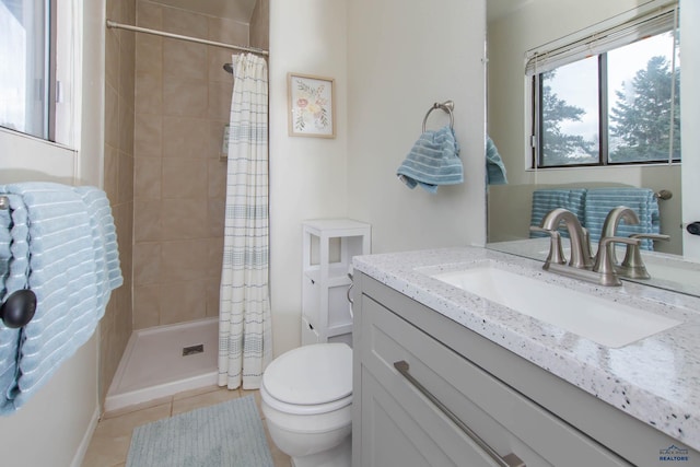 3005 Glenwood Dr, Rapid City, SD 57702 - full bathroom with vanity, tile patterned flooring, toilet, and a shower stall