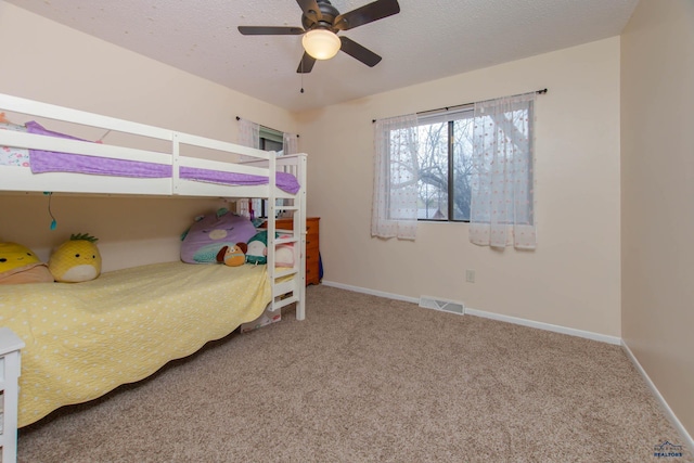 3005 Glenwood Dr, Rapid City, SD 57702 - carpeted bedroom with baseboards, a ceiling fan, and visible vents
