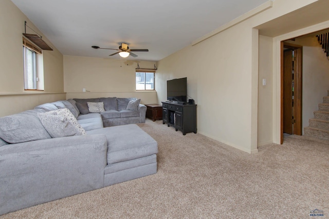 3005 Glenwood Dr, Rapid City, SD 57702 - living room featuring baseboards, stairs, ceiling fan, and light carpet