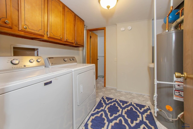3005 Glenwood Dr, Rapid City, SD 57702 - laundry area with cabinet space, washing machine and dryer, light floors, and gas water heater