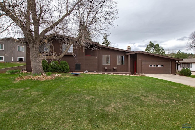 3005 Glenwood Dr, Rapid City, SD 57702 - view of front of house featuring an attached garage, a chimney, driveway, and a front lawn