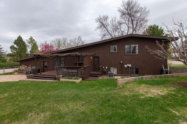 3005 Glenwood Dr, Rapid City, SD 57702 - rear view of house with a lawn, central air condition unit, a deck, and fence