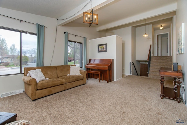 3005 Glenwood Dr, Rapid City, SD 57702 - carpeted living room featuring stairs, a notable chandelier, visible vents, and baseboards