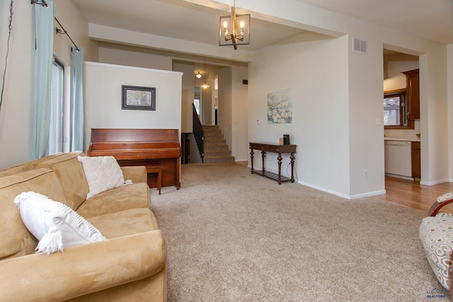3005 Glenwood Dr, Rapid City, SD 57702 - living room featuring visible vents, baseboards, a chandelier, carpet, and stairs