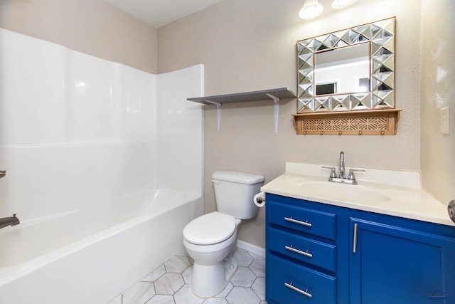 bathroom featuring tile patterned flooring, vanity, toilet, baseboards, and shower / bathing tub combination