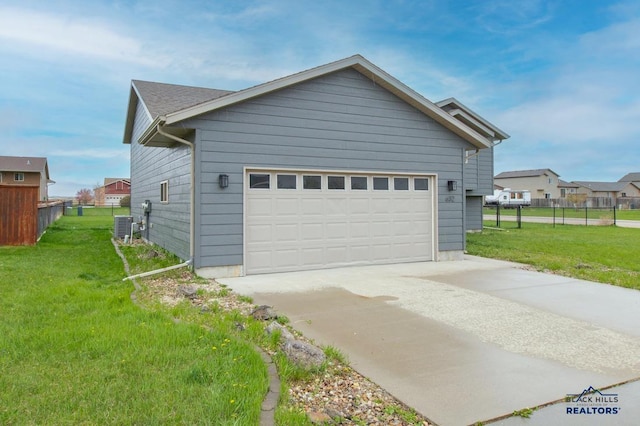 view of property exterior featuring fence, central AC unit, a yard, and driveway