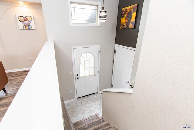 foyer entrance with baseboards