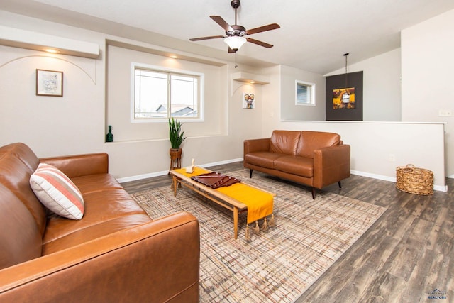 living room with baseboards, a ceiling fan, wood finished floors, and lofted ceiling