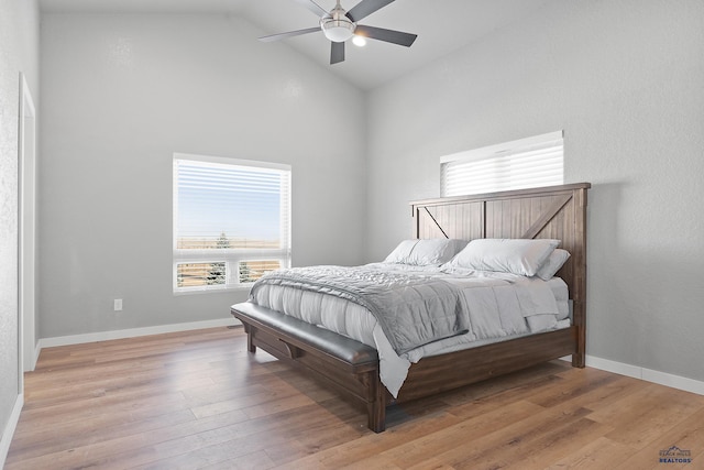 13416 Frontier Loop, Piedmont, SD 57769 - bedroom featuring high vaulted ceiling, baseboards, and light wood-style flooring