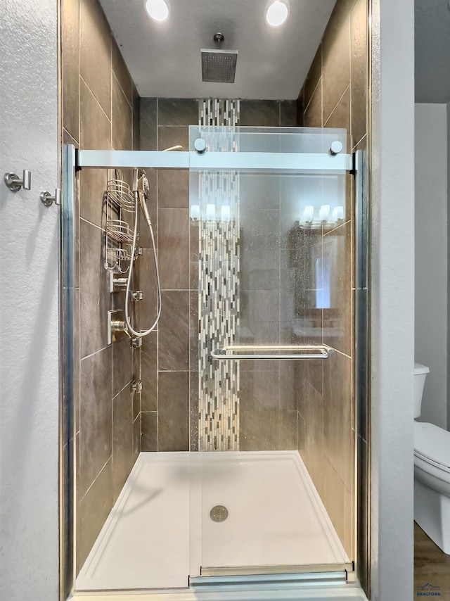 13416 Frontier Loop, Piedmont, SD 57769 - full bathroom featuring toilet, recessed lighting, and a shower stall