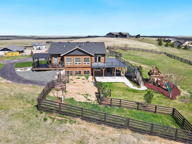 13416 Frontier Loop, Piedmont, SD 57769 - back of property with a fenced backyard, a wooden deck, and stairway