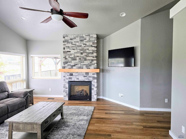 13416 Frontier Loop, Piedmont, SD 57769 - living room with baseboards, ceiling fan, a fireplace, and wood finished floors