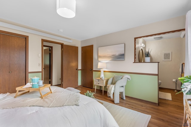 bedroom with wood finished floors