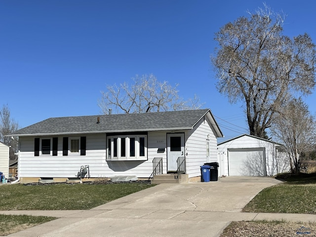 ranch-style house with roof with shingles, an outbuilding, a detached garage, concrete driveway, and entry steps