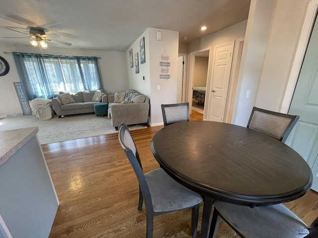 dining room with recessed lighting, ceiling fan, and wood finished floors