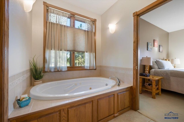 full bathroom featuring connected bathroom and a jetted tub