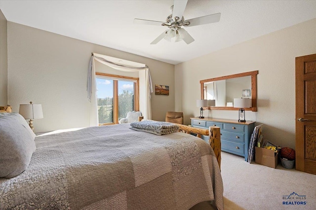 bedroom with ceiling fan and light colored carpet