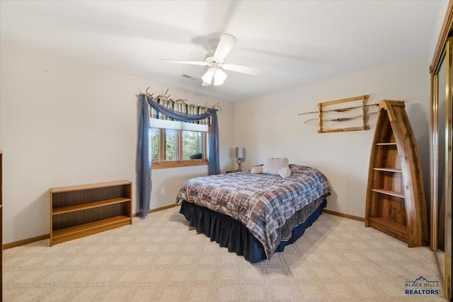 carpeted bedroom featuring baseboards, ceiling fan, and a closet