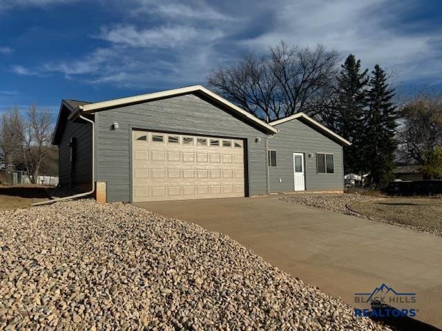 3226 W Rapid, Rapid City, SD 57702 - view of front facade with driveway and a garage