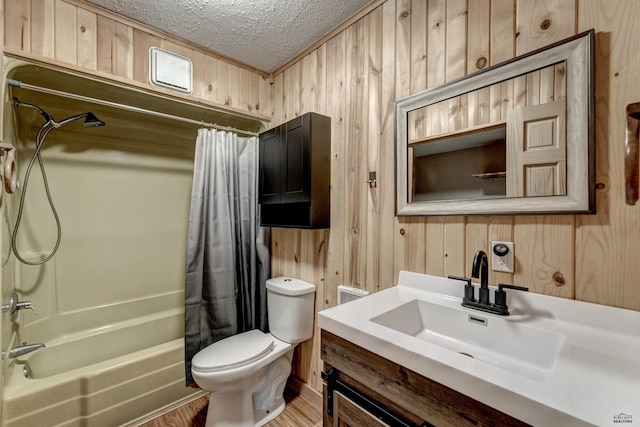 full bath with wood walls, wood finished floors, toilet, a textured ceiling, and shower / tub combo