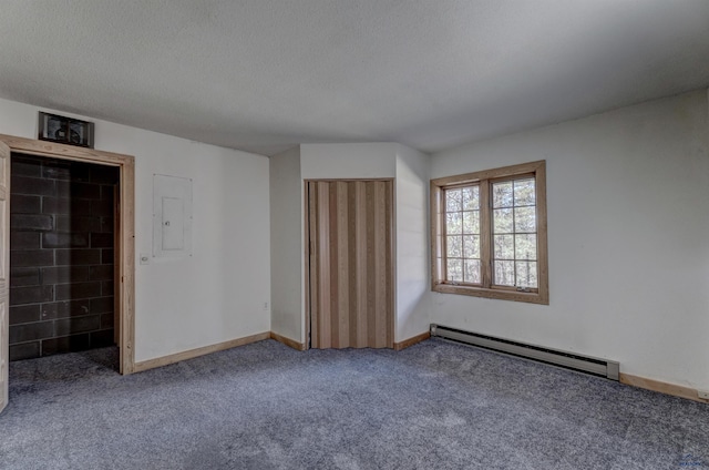 interior space featuring baseboards, baseboard heating, and a textured ceiling
