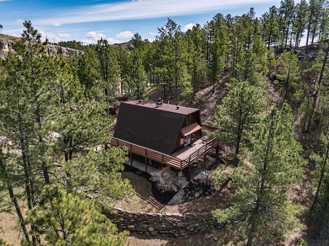 drone / aerial view featuring a view of trees