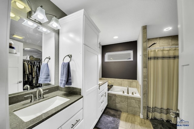 4376 Vinecliff Dr, Rapid City, SD 57701 - full bath with vanity, wood finished floors, recessed lighting, a bath, and a shower with curtain