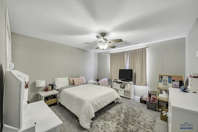 4376 Vinecliff Dr, Rapid City, SD 57701 - carpeted bedroom featuring visible vents and ceiling fan