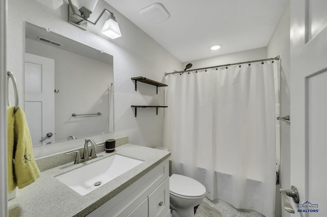 4376 Vinecliff Dr, Rapid City, SD 57701 - full bathroom with visible vents, shower / bath combo with shower curtain, toilet, and vanity