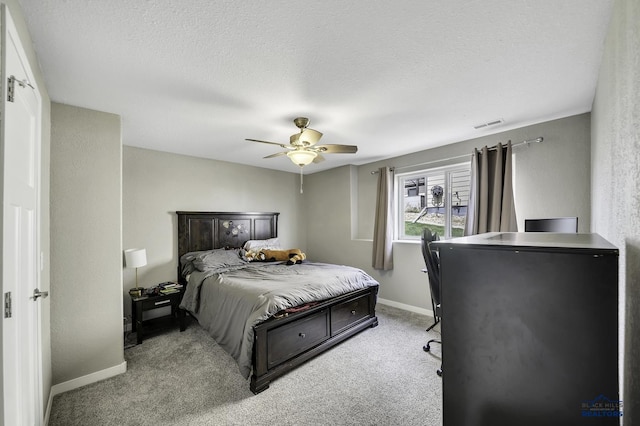 4376 Vinecliff Dr, Rapid City, SD 57701 - carpeted bedroom featuring baseboards, a textured ceiling, and ceiling fan