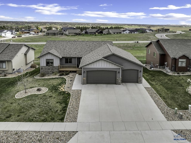 4376 Vinecliff Dr, Rapid City, SD 57701 - view of front facade featuring board and batten siding, a residential view, roof with shingles, and a garage