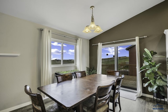 4376 Vinecliff Dr, Rapid City, SD 57701 - dining space featuring baseboards, vaulted ceiling, and wood finished floors