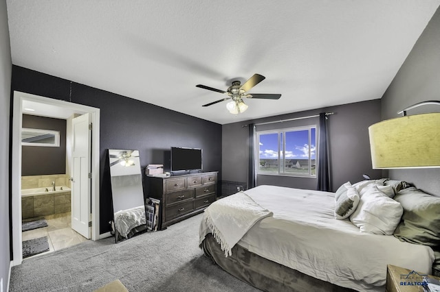 4376 Vinecliff Dr, Rapid City, SD 57701 - bedroom with connected bathroom, ceiling fan, and carpet