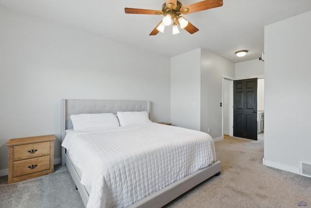 carpeted bedroom with baseboards, ceiling fan, and visible vents