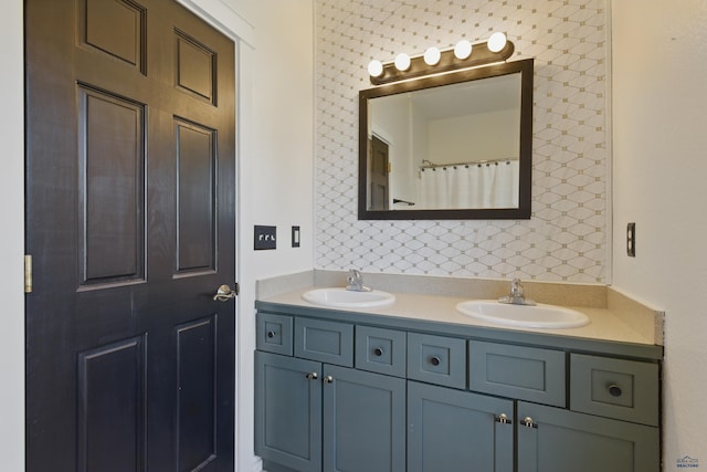full bath featuring a sink and double vanity